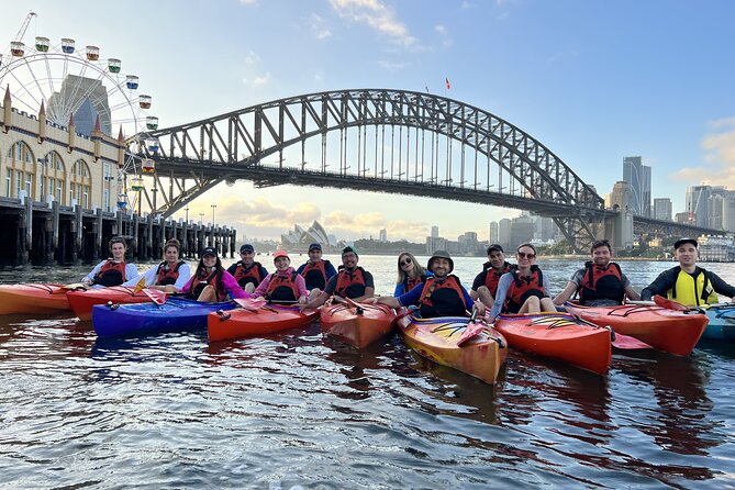 Sydney Harbour Bridge Kayak & Breakfast Tour - Under the Harbour Bridge: the moment the kayak becomes part of the landmark