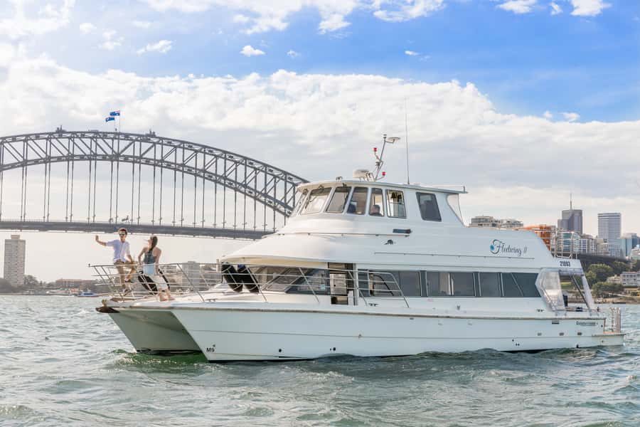 Sydney: Vivid Harbour Cruise with Canapes - Boarding the catamaran: where you’ll want to stand (and hide from cold)